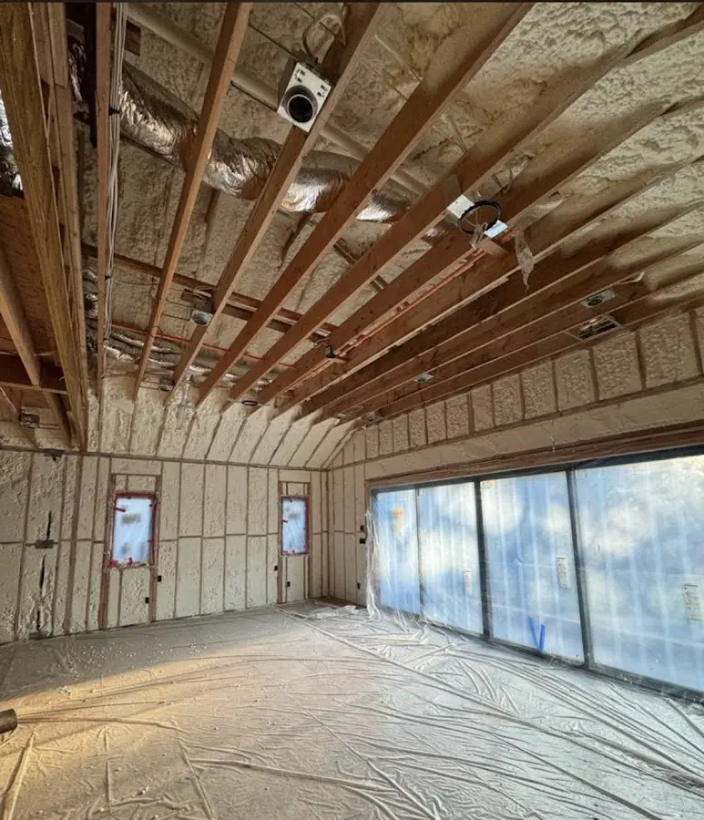 Interior walls and ceiling insulated with spray foam during new construction in Alpine